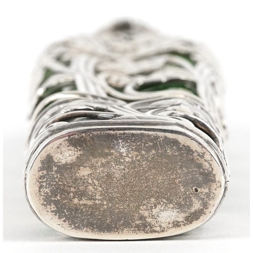 497 - Large silver overlaid green glass scent bottle pierced and embossed with stylized flowers, SJ maker'... 