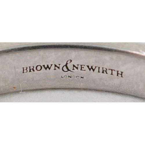 3025 - Brown & Newirth white metal wedding band, indistinct hallmarks, size M, 2.5g.