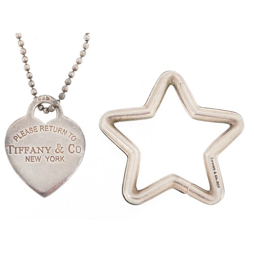3060 - Tiffany & Co., a sterling silver star shaped split ring and love heart charm on a broken necklace, 3... 