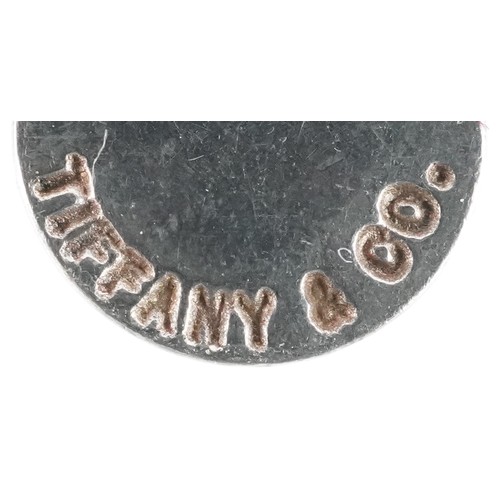 3060 - Tiffany & Co., a sterling silver star shaped split ring and love heart charm on a broken necklace, 3... 