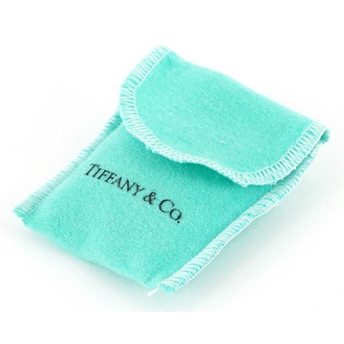 3060 - Tiffany & Co., a sterling silver star shaped split ring and love heart charm on a broken necklace, 3... 