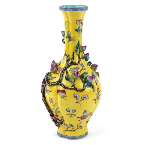 57 - Chinese porcelain bottleneck vase moulded in relief with a mango tree, hand painted onto a yellow gr... 