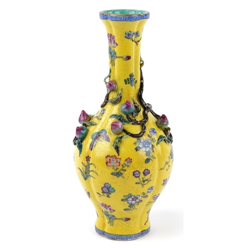 57 - Chinese porcelain bottleneck vase moulded in relief with a mango tree, hand painted onto a yellow gr... 
