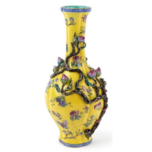 57 - Chinese porcelain bottleneck vase moulded in relief with a mango tree, hand painted onto a yellow gr... 