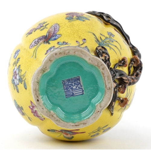 57 - Chinese porcelain bottleneck vase moulded in relief with a mango tree, hand painted onto a yellow gr... 