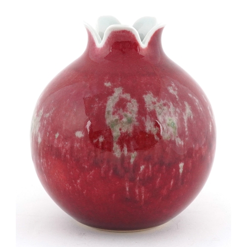 59 - Chinese porcelain pomegranate vase having a sang de boeuf glaze, six figure character marks to the b... 