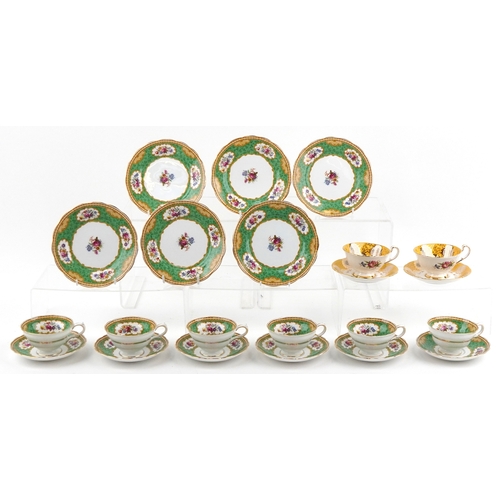 1054 - Grosvenor china teacups and saucers in the Sandringham pattern together with Paragon teacups and sau... 