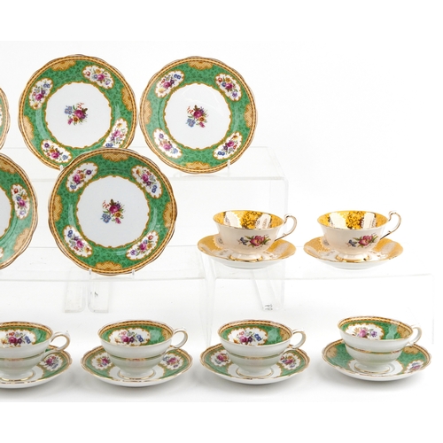 1054 - Grosvenor china teacups and saucers in the Sandringham pattern together with Paragon teacups and sau... 
