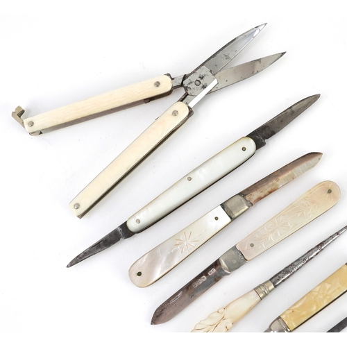 54 - Antique and later pocket tools including two mother of pearl flanked pocket knives with silver blade... 