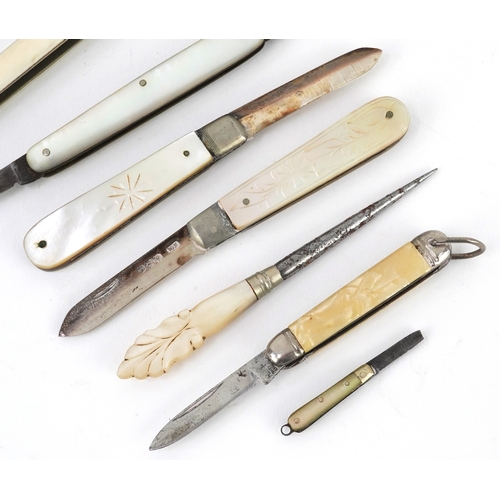 54 - Antique and later pocket tools including two mother of pearl flanked pocket knives with silver blade... 