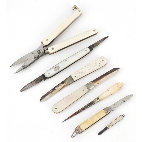 54 - Antique and later pocket tools including two mother of pearl flanked pocket knives with silver blade... 