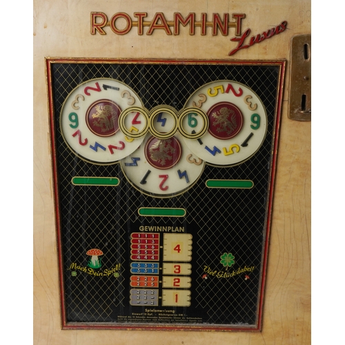 1960s Rotamint Luxus slot machine, 70cm high x 51cm wide.