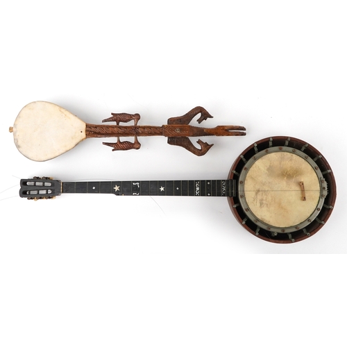 1112 - Musical instruments comprising a part rosewood cased banjo with mother of pearl inlays together with... 