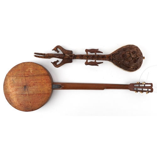 1112 - Musical instruments comprising a part rosewood cased banjo with mother of pearl inlays together with... 