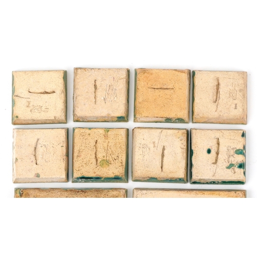 23 - Carter & Co., eighteen early 20th century Poole pottery maritime interest tiles - three levels of th... 