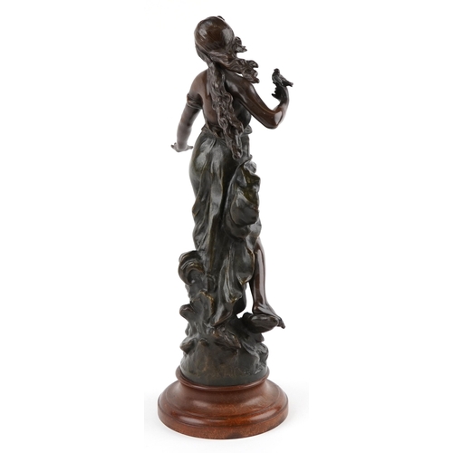 11 - After Auguste Moreau, late 19th century patinated spelter figure of a female with a birds, titled Le... 