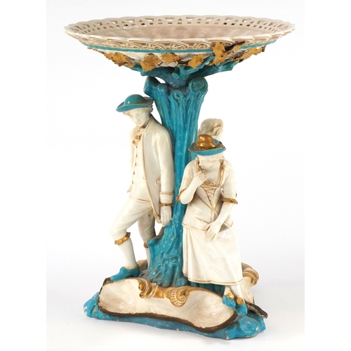 26 - 19th century Continental porcelain tazza moulded as figures resting under a tree, 34cm high x 26cm i... 