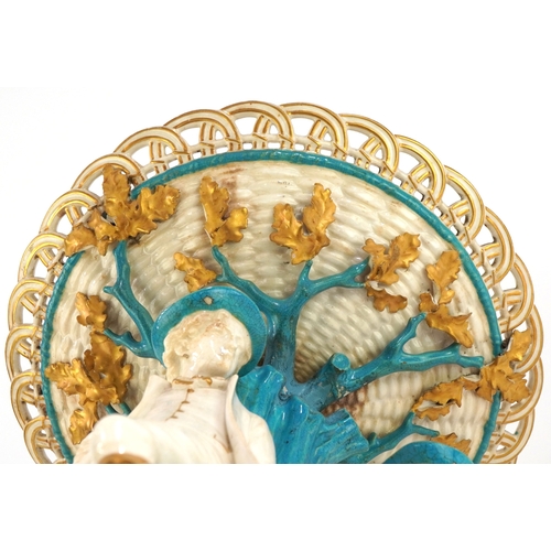26 - 19th century Continental porcelain tazza moulded as figures resting under a tree, 34cm high x 26cm i... 