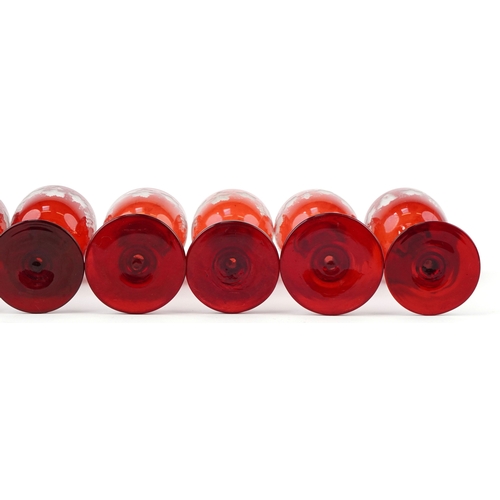 35 - Eight antique Bohemian cranberry glasses etched with grapevines, 15cm high.