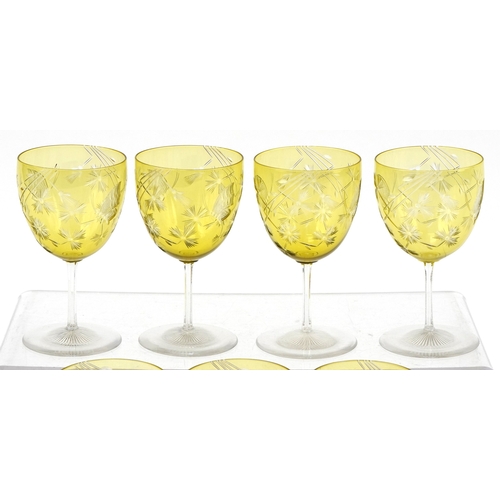 32 - Set of seven antique overlaid wine glasses etched with thistles and butterflies, 11.2cm high.