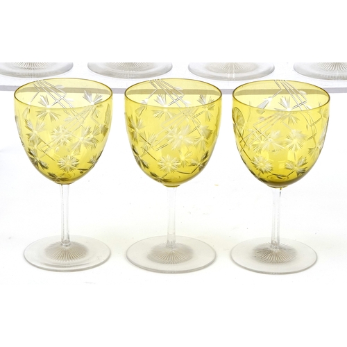 32 - Set of seven antique overlaid wine glasses etched with thistles and butterflies, 11.2cm high.