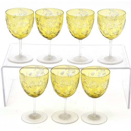 32 - Set of seven antique overlaid wine glasses etched with thistles and butterflies, 11.2cm high.