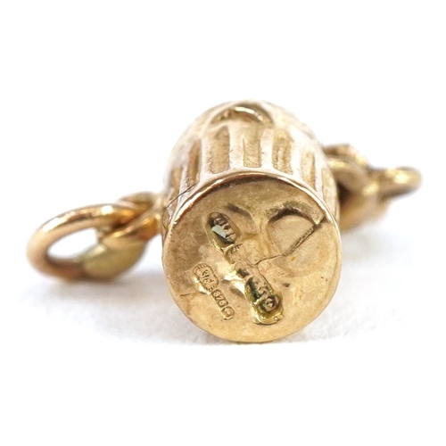 3299 - 9ct gold articulated charm in the form of a cat in a can, 1.2cm high, 1.2g.