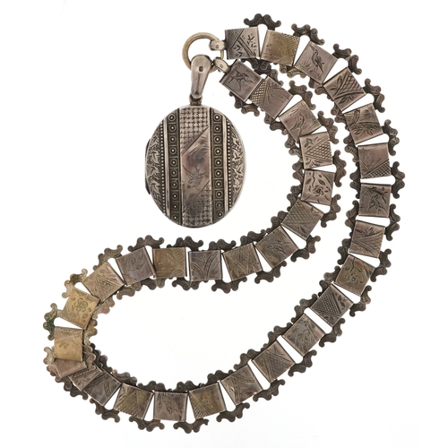 Victorian aesthetic silver locket on an unmarked white metal necklace engraved with birds, 5.5cm high and 40cm in length, total 55.0g.