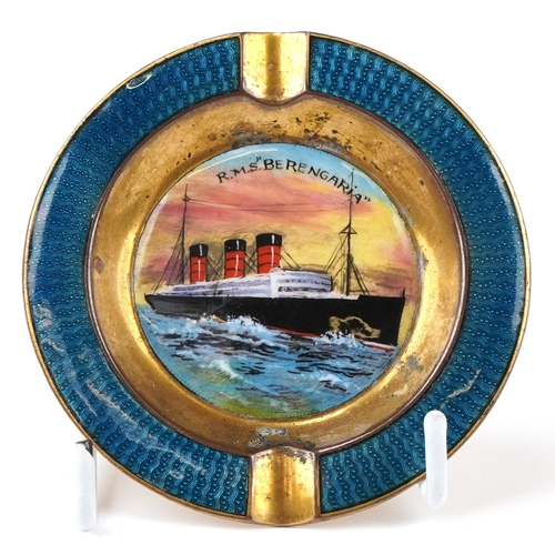 Early 20th century SS Imperator (RMS Berengaria) brass and guilloche enamel souvenir ashtray, hand painted with a central panel of the ocean liner, 7.5cm in diameter.