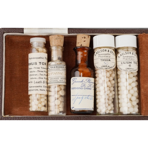 130 - Antique pharmaceutical glass bottles, some housed in a leather James Epps & Co. Ltd. Homeopathic Che... 