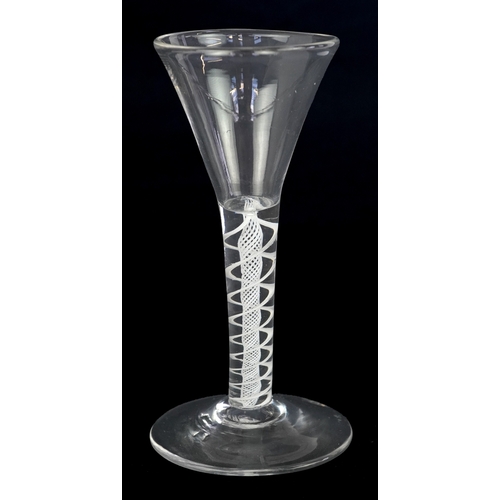 106 - 18th century miniature wine glass with air twist stem, 10cm high.