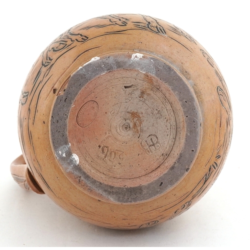 18 - Hannah Barlow for Doulton Lambeth, stoneware jug incised with a goat protecting its kid from a dog, ... 