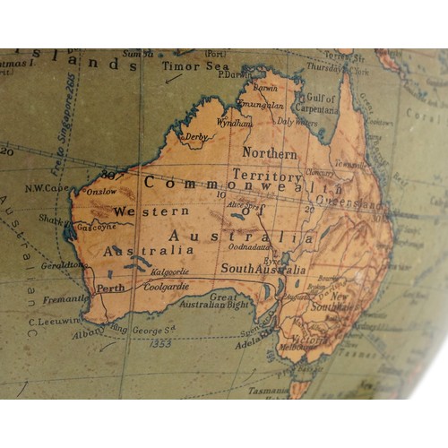 353 - George Philip & Son twelve inch terrestrial globe raised on a plinth base, 34cm high.