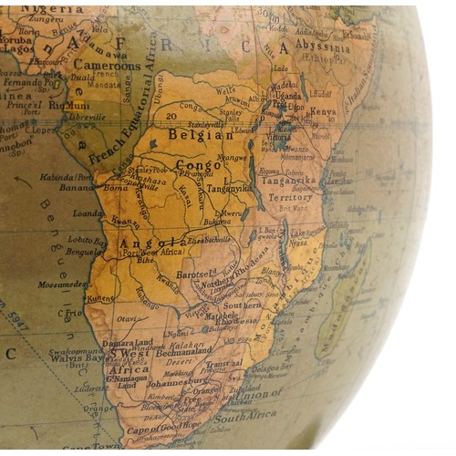 353 - George Philip & Son twelve inch terrestrial globe raised on a plinth base, 34cm high.