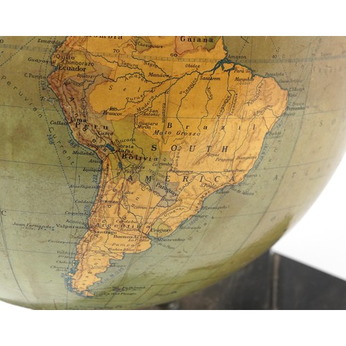 353 - George Philip & Son twelve inch terrestrial globe raised on a plinth base, 34cm high.