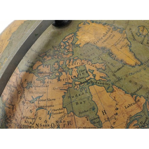 353 - George Philip & Son twelve inch terrestrial globe raised on a plinth base, 34cm high.