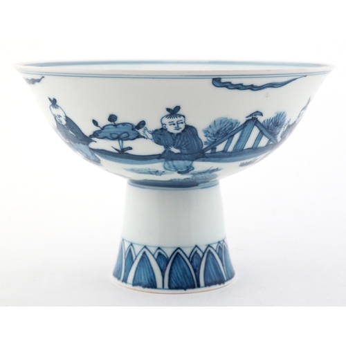 60 - Chinese blue and white porcelain pedestal bowl hand painted with children, character marks to the ba... 