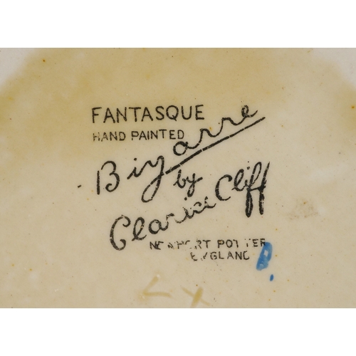 152 - Clarice Cliff, Art Deco pottery comprising a teacup hand painted in the Gayday pattern, a salt shake... 