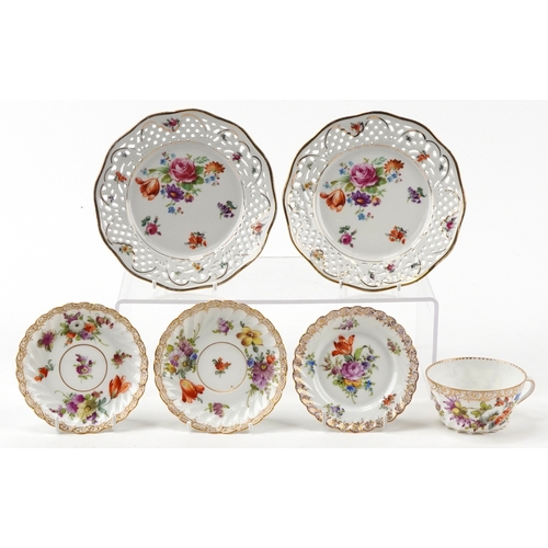306 - Dresden porcelain teacup with three saucers, hand painted with floral sprays and gilded decoration t... 
