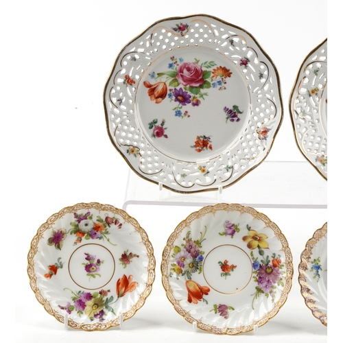 306 - Dresden porcelain teacup with three saucers, hand painted with floral sprays and gilded decoration t... 