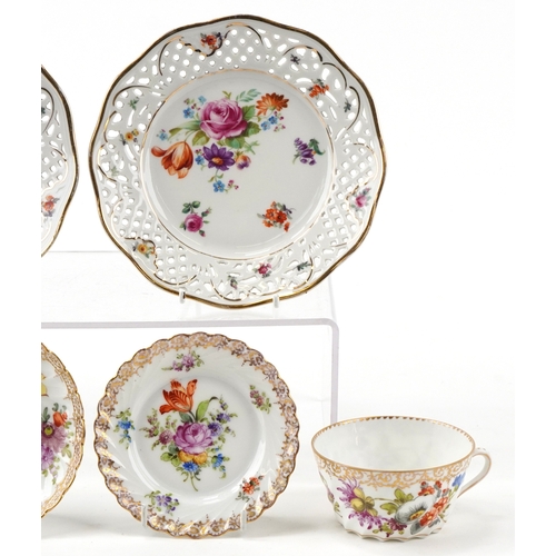 306 - Dresden porcelain teacup with three saucers, hand painted with floral sprays and gilded decoration t... 