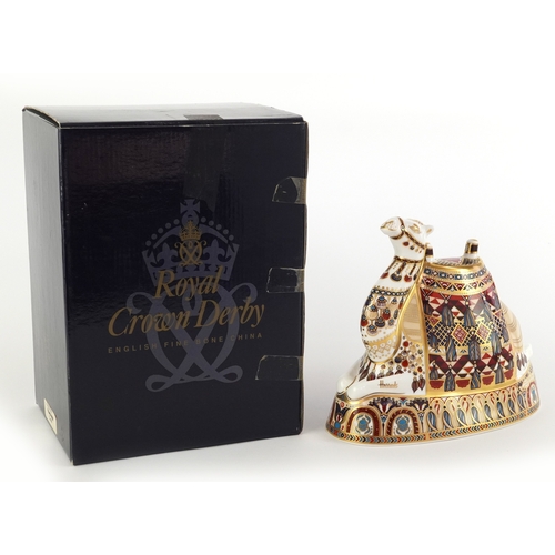 1007 - Royal Crown Derby Harrods Camel paperweight, gold coloured stopper to the base, 17cm high, boxed.