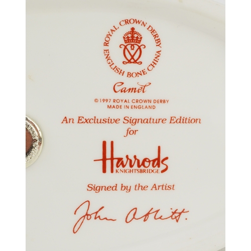 1007 - Royal Crown Derby Harrods Camel paperweight, gold coloured stopper to the base, 17cm high, boxed.
