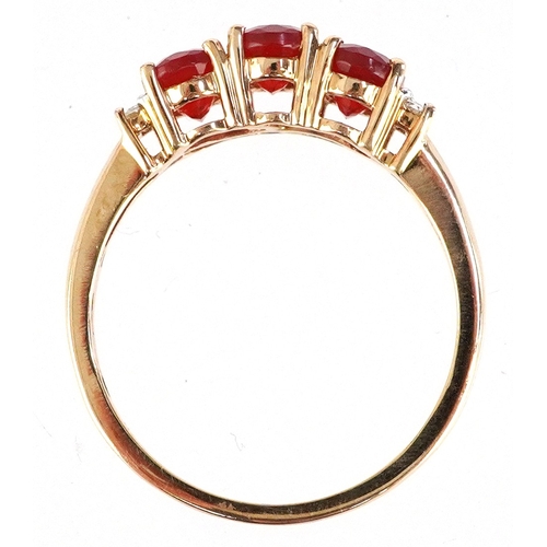 3015 - 14ct gold diamond and red stone ring, possibly fire opal, size R, 2.9g.