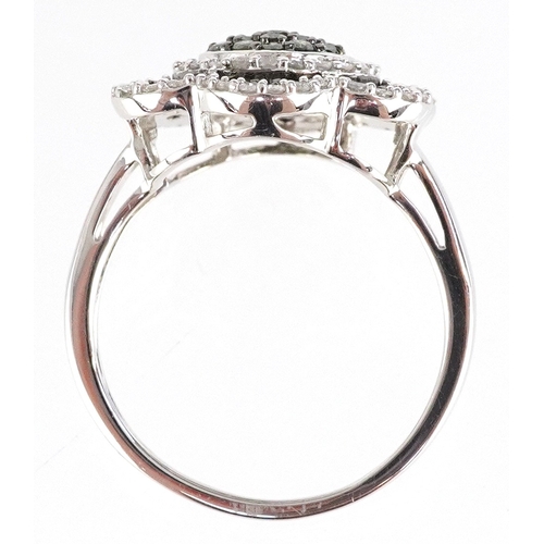 3011 - 9ct white gold green and white diamond flower head ring, size R, 5.2g.
