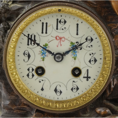 75 - After Moreau, early 20th century patinated spelter mantle clock cast with a recumbent female and emb... 