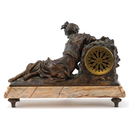 75 - After Moreau, early 20th century patinated spelter mantle clock cast with a recumbent female and emb... 
