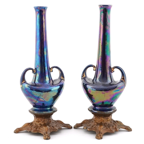 2378 - Pair of Art Nouveau pottery bud vases having a lustre glaze, raised on gilt metal bases, 19cm high.