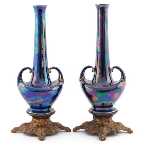 2378 - Pair of Art Nouveau pottery bud vases having a lustre glaze, raised on gilt metal bases, 19cm high.