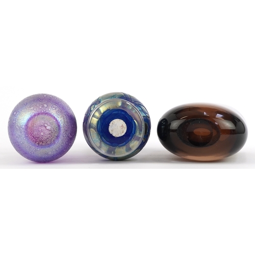 320 - Three art glass vases comprising a heavy smoky brown example, a Heron iridescent glass vase and an I... 